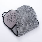 Gray grooming mitt with paw design on a white background